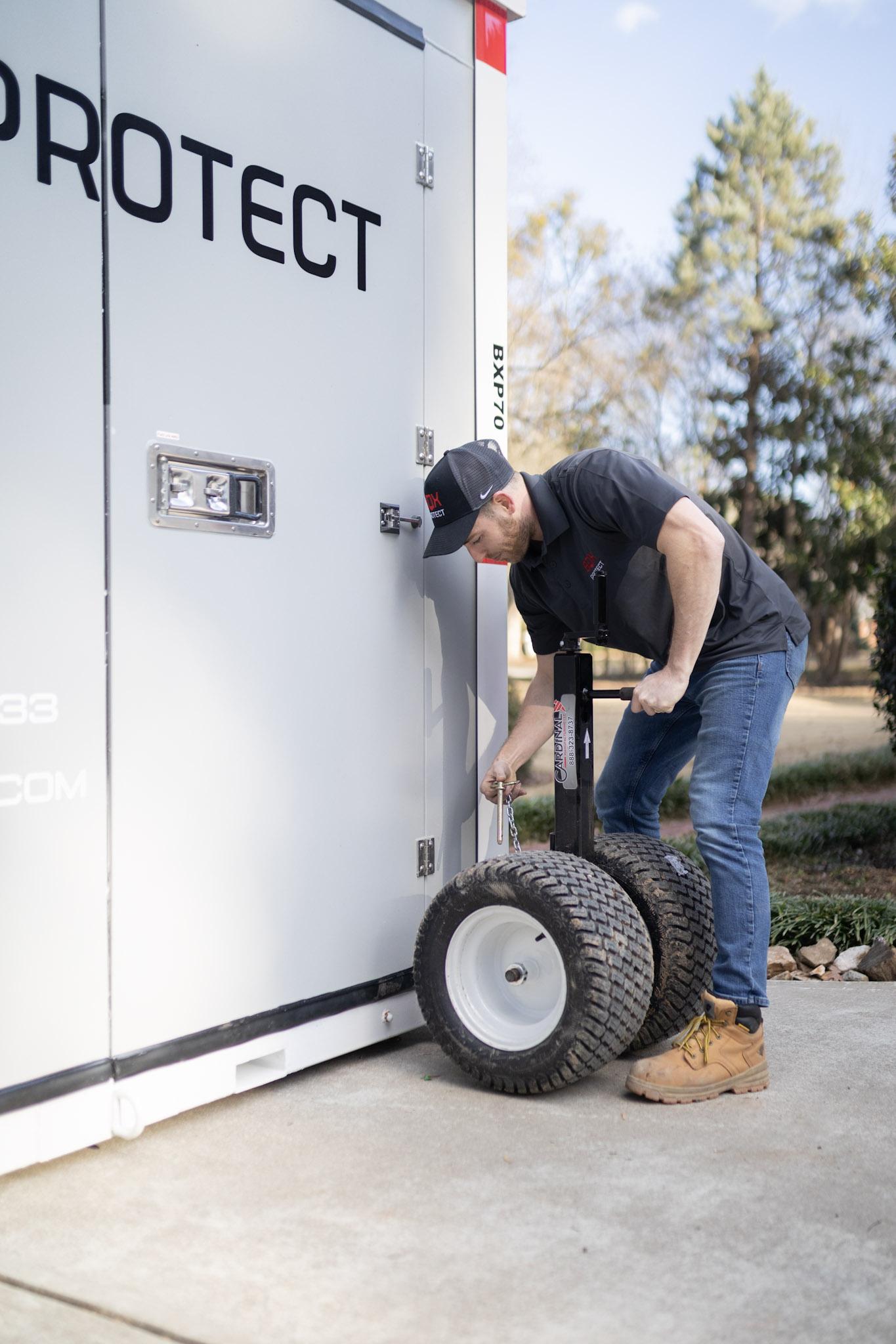BoxProtect team member working with storage container